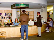 Photo of students at the Reference Desk in the Library