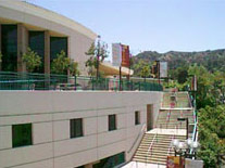 Photos of Library building showing outside stairs on west side of curved wall.